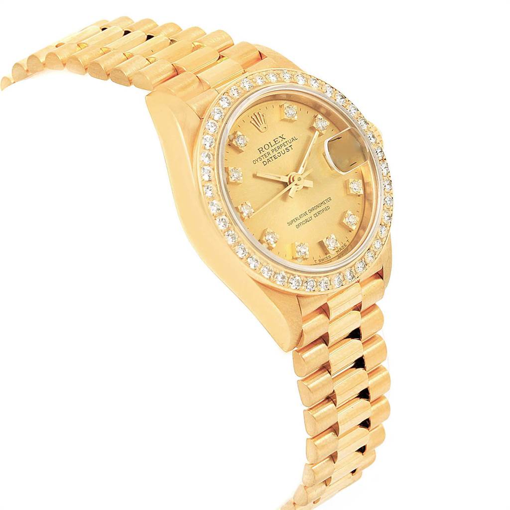 The Rolex President 69138 Women's Yellow Gold Champagne Dial 69138 Women's Yellow Gold Champagne Dial model watch is shown at a slight angle, highlighting its gold bracelet, diamond-set bezel, and dial.