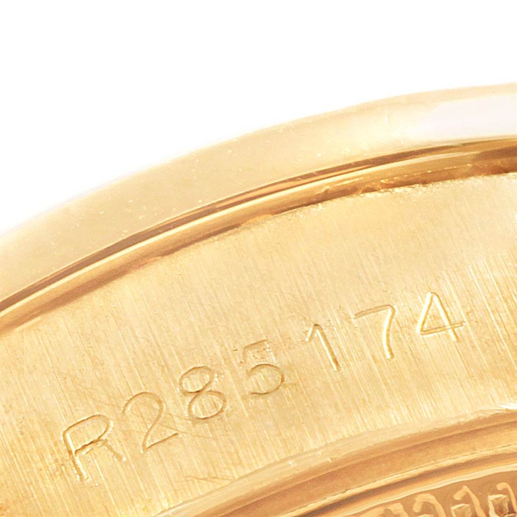 This close-up image shows part of the case back with a serial number engraved on the Rolex President 69138 Women's Yellow Gold Champagne Dial 69138 Women's Yellow Gold Champagne Dial model watch.