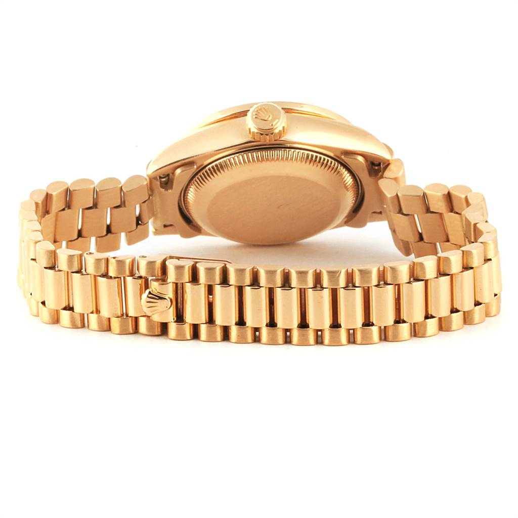 The image shows the back view of a Rolex President 69178 Women
s Yellow Gold Champagne Dial 69178 Women
s Yellow Gold Champagne Dial model watch, highlighting the case back and the bracelet.