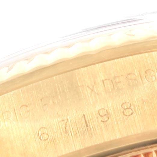 The image shows a close-up angle of the engraved side of the bezel on a Rolex President 67198 Women
s Yellow Gold Champagne Dial 67198 Women
s Yellow Gold Champagne Dial model watch.