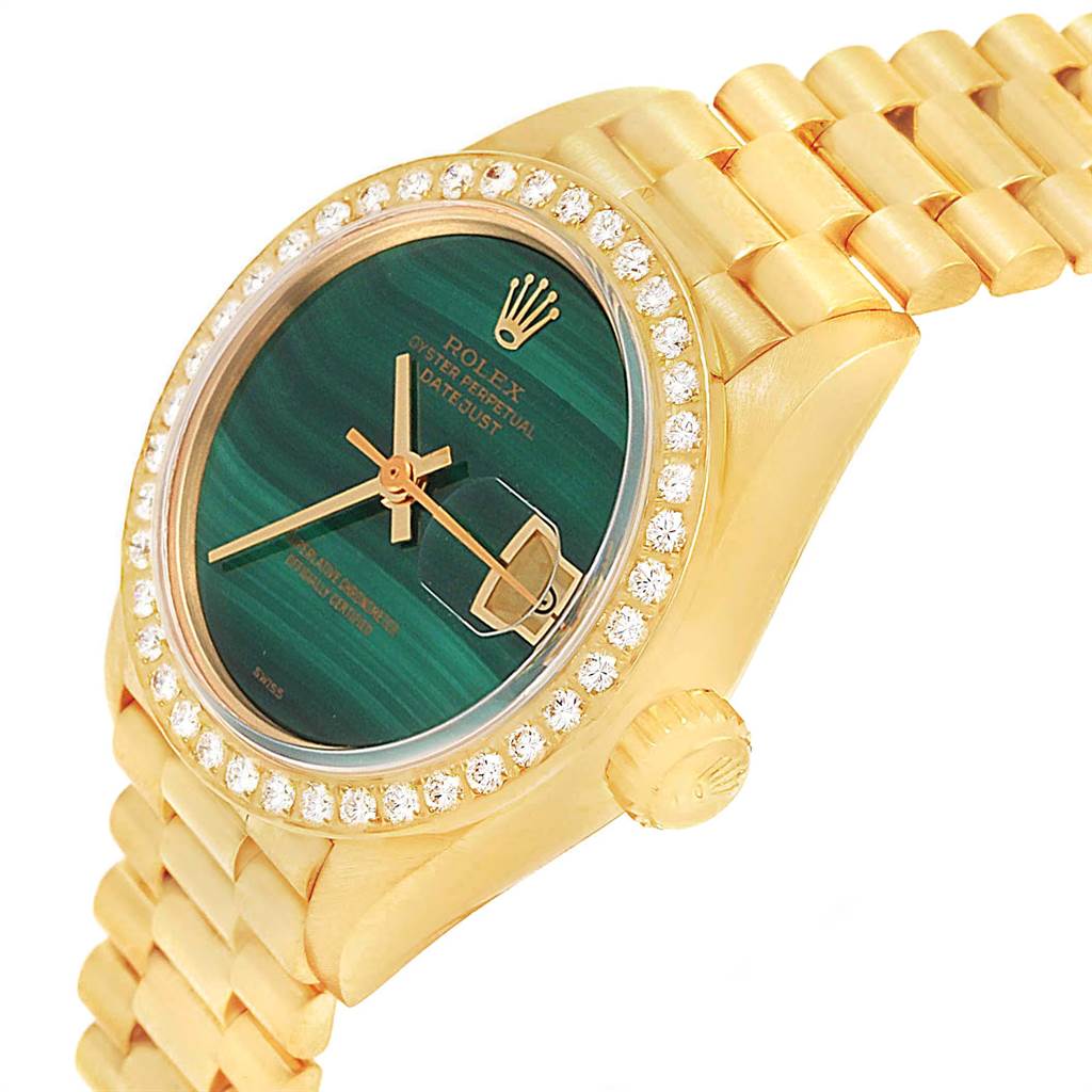 The image shows a Rolex President 69178 Women
s Yellow Gold Green Dial 69178 Women
s Yellow Gold Green Dial model watch at an angle, highlighting its face, bezel, crown, and part of its bracelet.