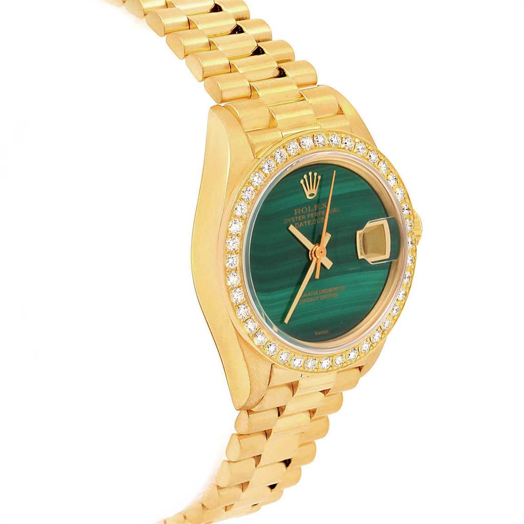 The Rolex President 69178 Women
s Yellow Gold Green Dial 69178 Women
s Yellow Gold Green Dial model watch is shown at an angle highlighting its green dial, diamond bezel, and gold bracelet.