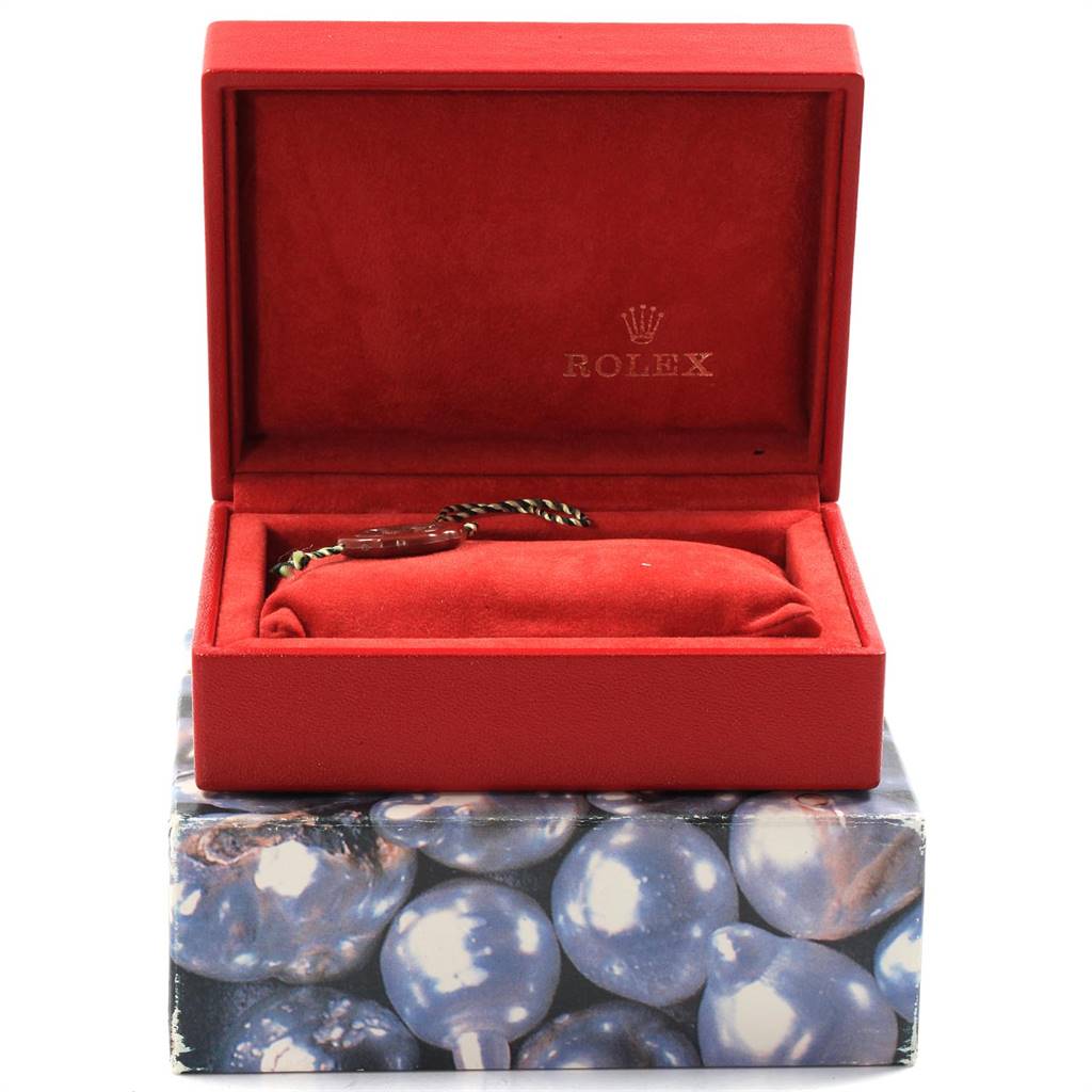 The image shows a red Rolex box containing a bracelet or tag for the Rolex President 69178 Women
s Yellow Gold Black Dial 69178 Women
s Yellow Gold Black Dial model watch.