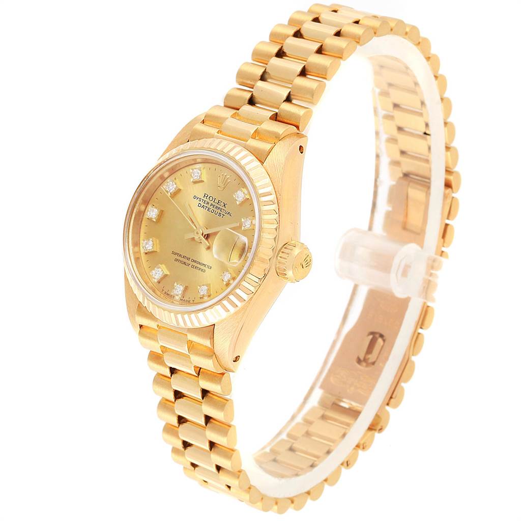 This image shows a Rolex President 6917 Women's Yellow Gold Champagne Dial 6917 Women's Yellow Gold Champagne Dial model watch at a three-quarter angle highlighting the gold band, crown, and face with diamond indices.