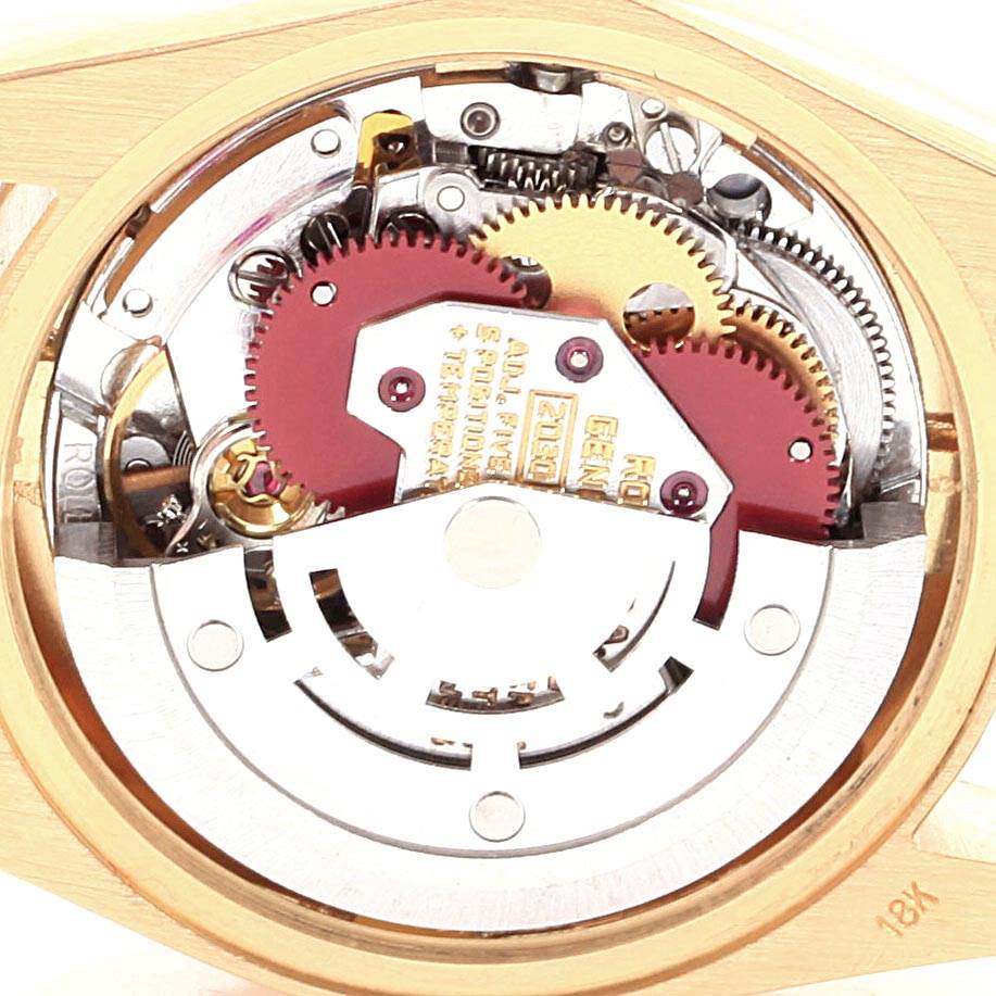 The image shows the intricate inner mechanism of a Rolex President 6917 Women's Yellow Gold Champagne Dial 6917 Women's Yellow Gold Champagne Dial model watch at a close-up angle.