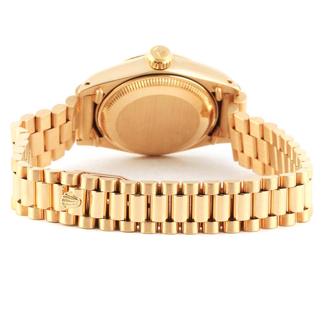 The image shows the back view of a Rolex President 6917 Women's Yellow Gold Champagne Dial 6917 Women's Yellow Gold Champagne Dial model watch, highlighting the bracelet and case back.