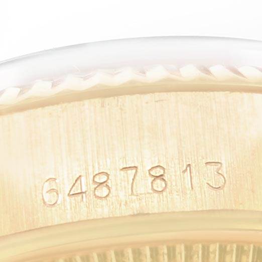 The close-up image shows the side of a Rolex President 6917 Women's Yellow Gold Champagne Dial 6917 Women's Yellow Gold Champagne Dial watch case, focusing on its engraved serial number.