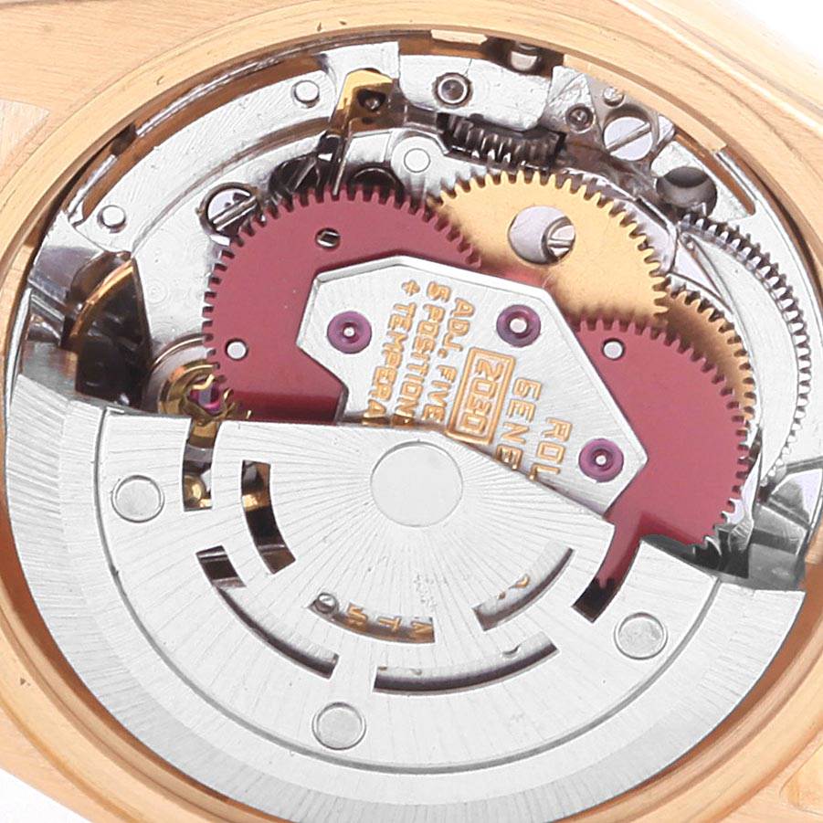 This image shows the inner mechanical movement of a Rolex President 6917 Women
s Yellow Gold Black Dial 6917 Women
s Yellow Gold Black Dial model watch from a close-up angle.