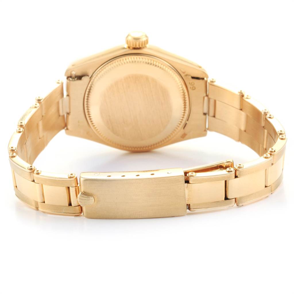 The image shows the back view and clasp of a Rolex President 6917 Women
s Yellow Gold Black Dial 6917 Women
s Yellow Gold Black Dial model watch, highlighting its gold bracelet and case back.