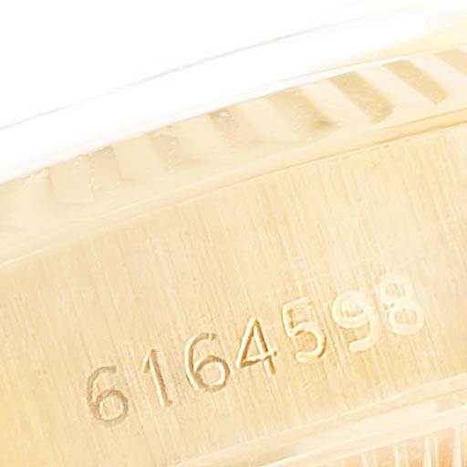 This image shows a close-up of the serial number on the case side edge of a Rolex President 6917 Women
s Yellow Gold Black Dial 6917 Women
s Yellow Gold Black Dial model watch.