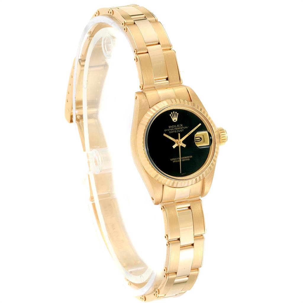 The President model by Rolex is shown at a slight angle displaying the gold bracelet, black dial, and date function.