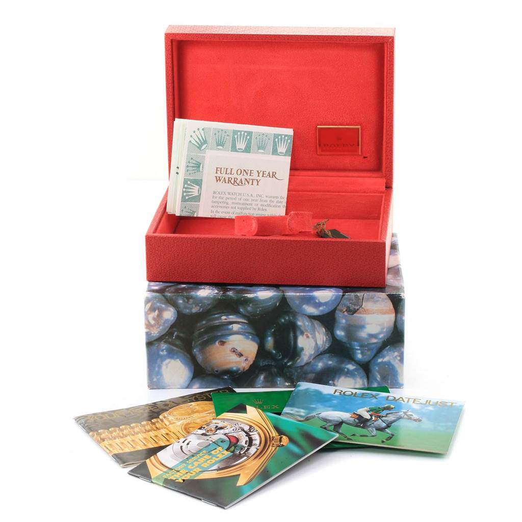 This image shows accessories for a Rolex President 79178 Women's Yellow Gold White Dial 79178 Women's Yellow Gold White Dial model, including packaging, warranty card, and booklets from a frontal angle.