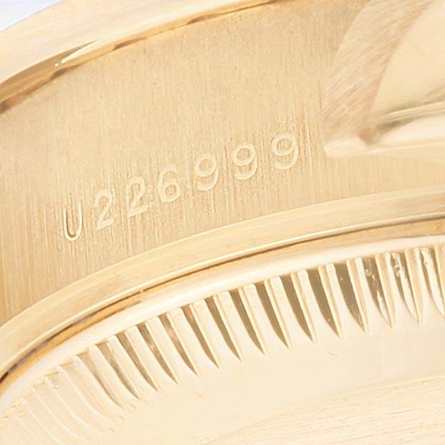This image shows a close-up of the serial number and part of the bezel on the Rolex President 79178 Women's Yellow Gold White Dial 79178 Women's Yellow Gold White Dial model watch.