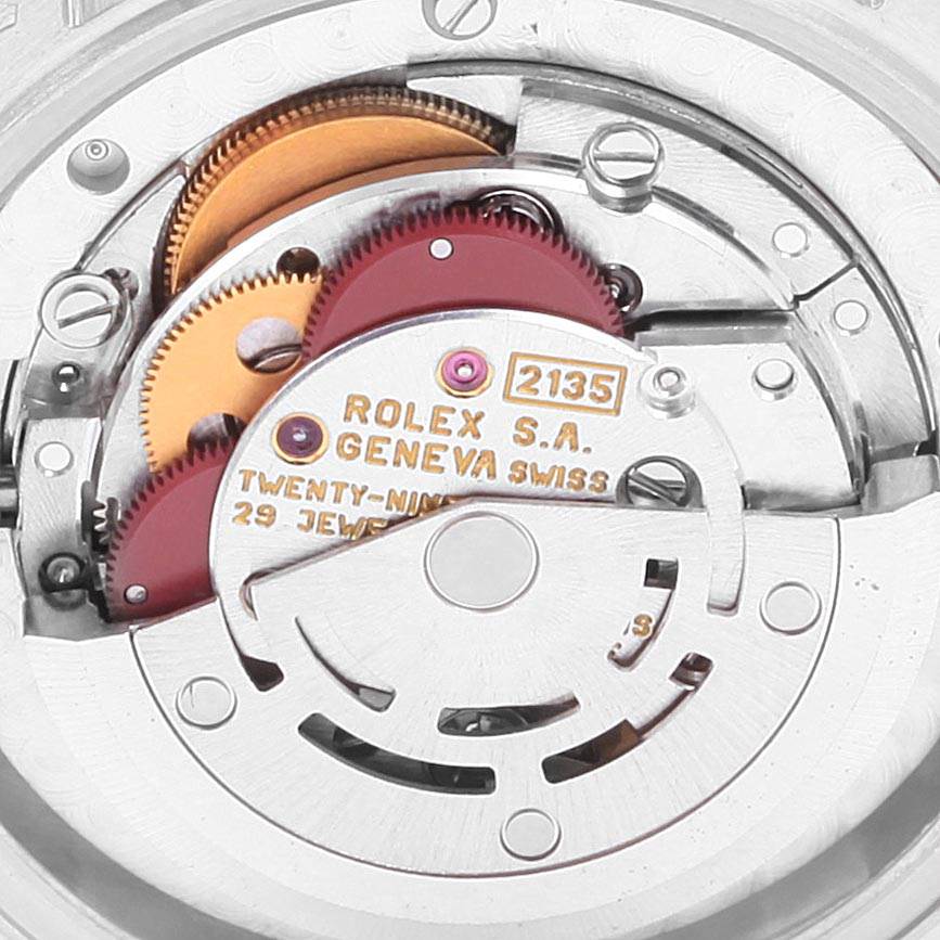 This image shows the intricate movement mechanism inside a Rolex President 68286 Women's Platinum Silver Dial 68286 Women's Platinum Silver Dial model watch, highlighting gears and the caliber 2135.