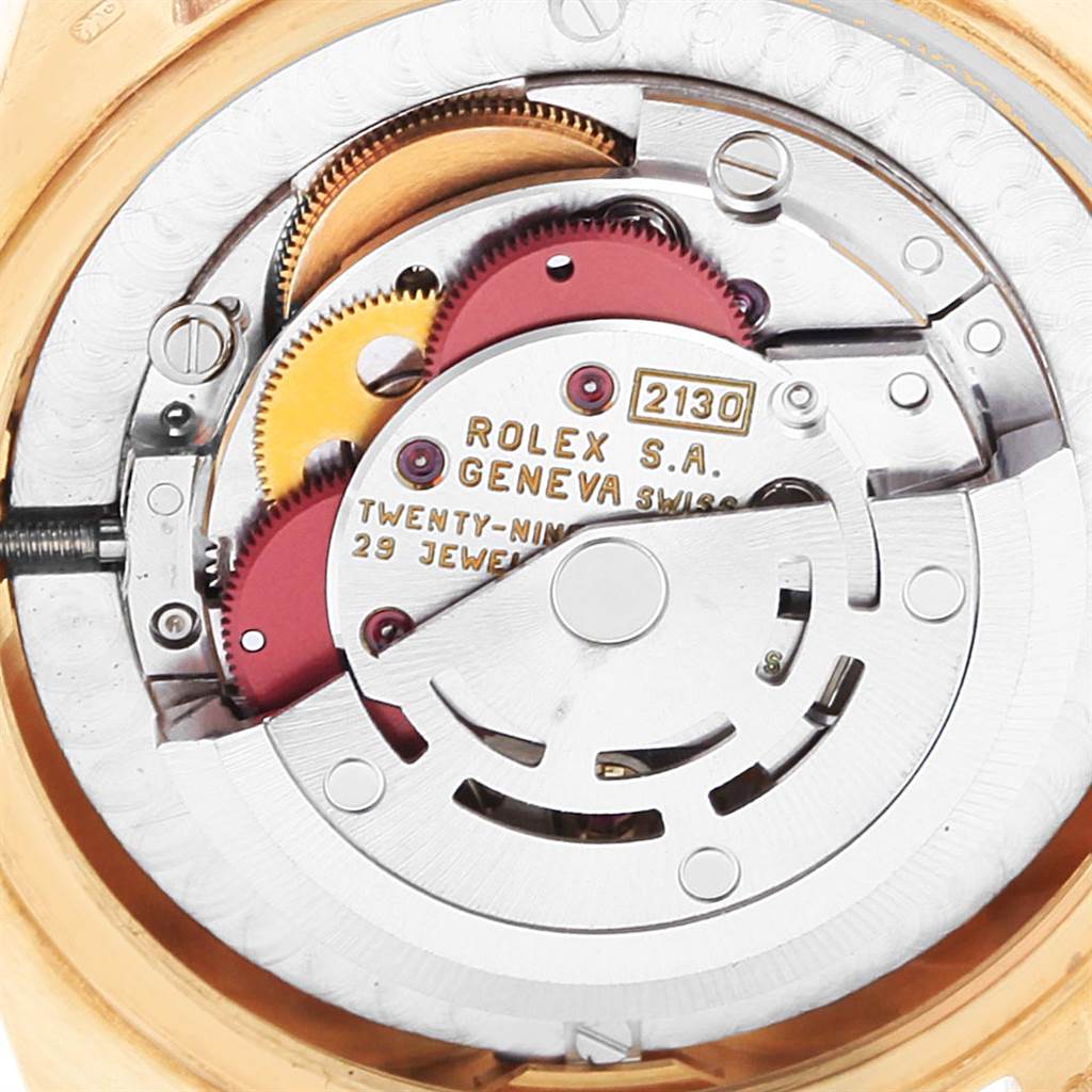 This image shows the intricate inner mechanism and movement of a Rolex President 67488 Women's Yellow Gold Blue Dial 67488 Women's Yellow Gold Blue Dial model watch.