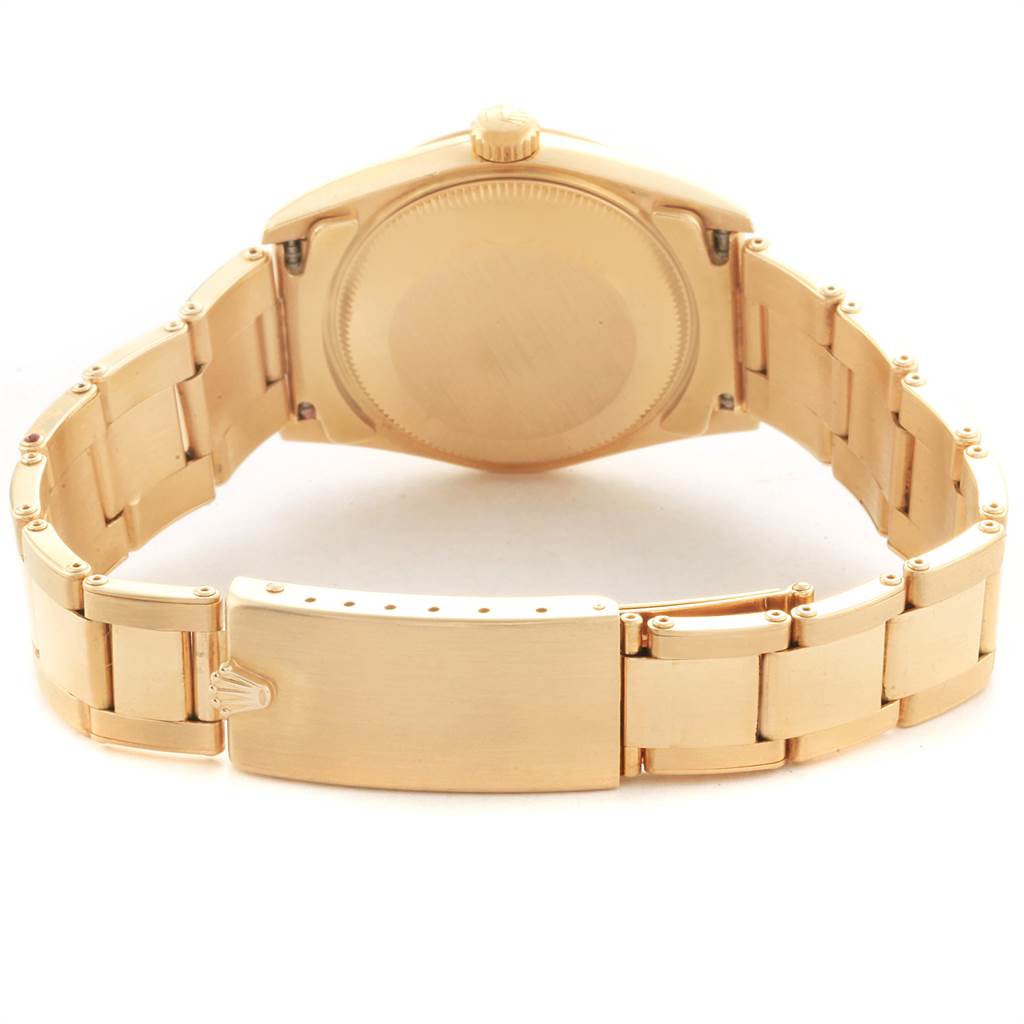 The image shows the backside and bracelet of a Rolex President 67488 Women's Yellow Gold Blue Dial 67488 Women's Yellow Gold Blue Dial model watch, focusing on the clasp and case back.