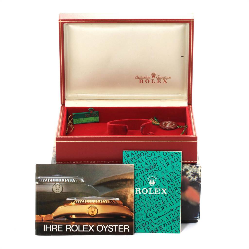 This image shows a Rolex President 67488 Women's Yellow Gold Blue Dial 67488 Women's Yellow Gold Blue Dial watch box, booklets, tags, and warranty papers, viewed from the front.