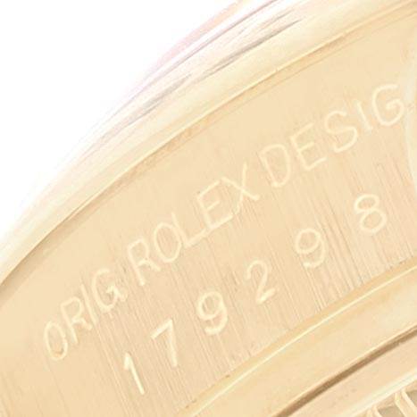 Close-up of the inner bezel of a Rolex President 179298 Women's Yellow Gold Silver Dial 179298 Women's Yellow Gold Silver Dial watch showing the model number and "ORIG ROLEX DESIG" engraving.