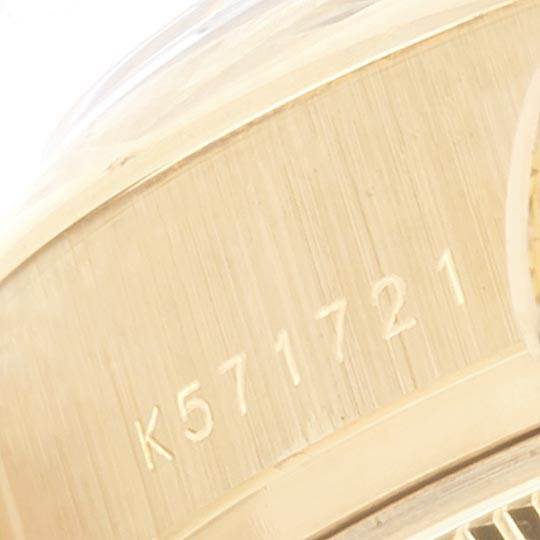 This close-up angle shows the serial number engraved on the inner side of the case of a Rolex President 179298 Women's Yellow Gold Silver Dial 179298 Women's Yellow Gold Silver Dial model watch.