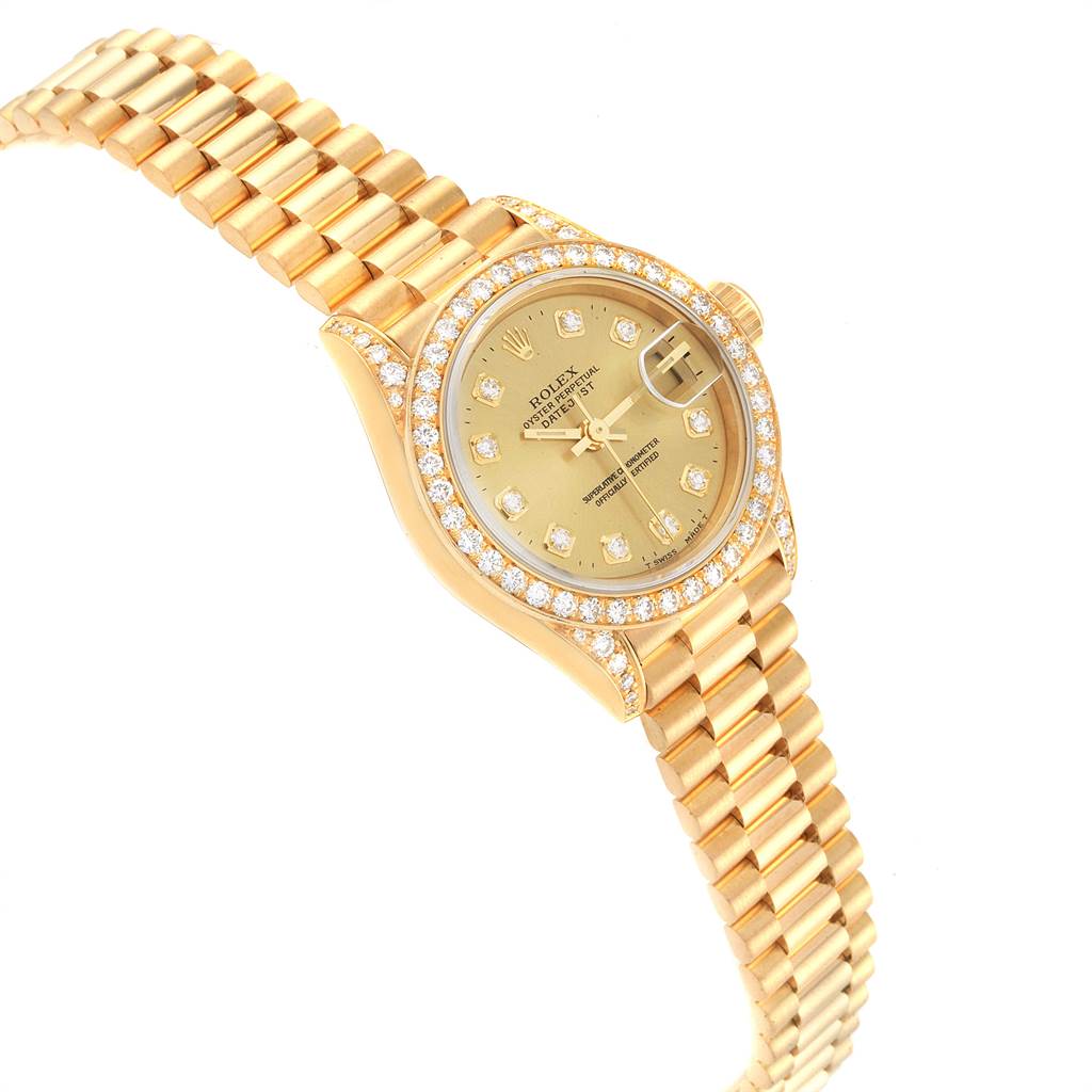 The Rolex President 69158 Women
s Yellow Gold Champagne Dial 69158 Women
s Yellow Gold Champagne Dial model watch is shown at a slight angle, displaying the face, bezel with diamonds, and part of the bracelet.