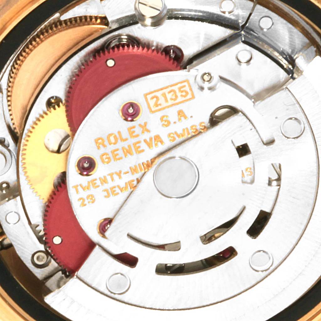 This image shows an angled view of the Rolex President 69158 Women
s Yellow Gold Champagne Dial 69158 Women
s Yellow Gold Champagne Dial model
s internal movement mechanism with gears and components.