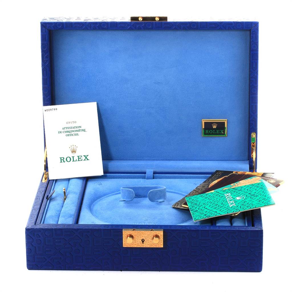 The image shows a Rolex President 69158 Women
s Yellow Gold Champagne Dial 69158 Women
s Yellow Gold Champagne Dial model watch box, including documentation and blue interior compartments for accessories.