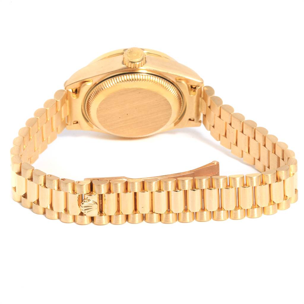 The image shows the back and bracelet of a Rolex President 69158 Women
s Yellow Gold Champagne Dial 69158 Women
s Yellow Gold Champagne Dial model watch, featuring its gold case and link design.