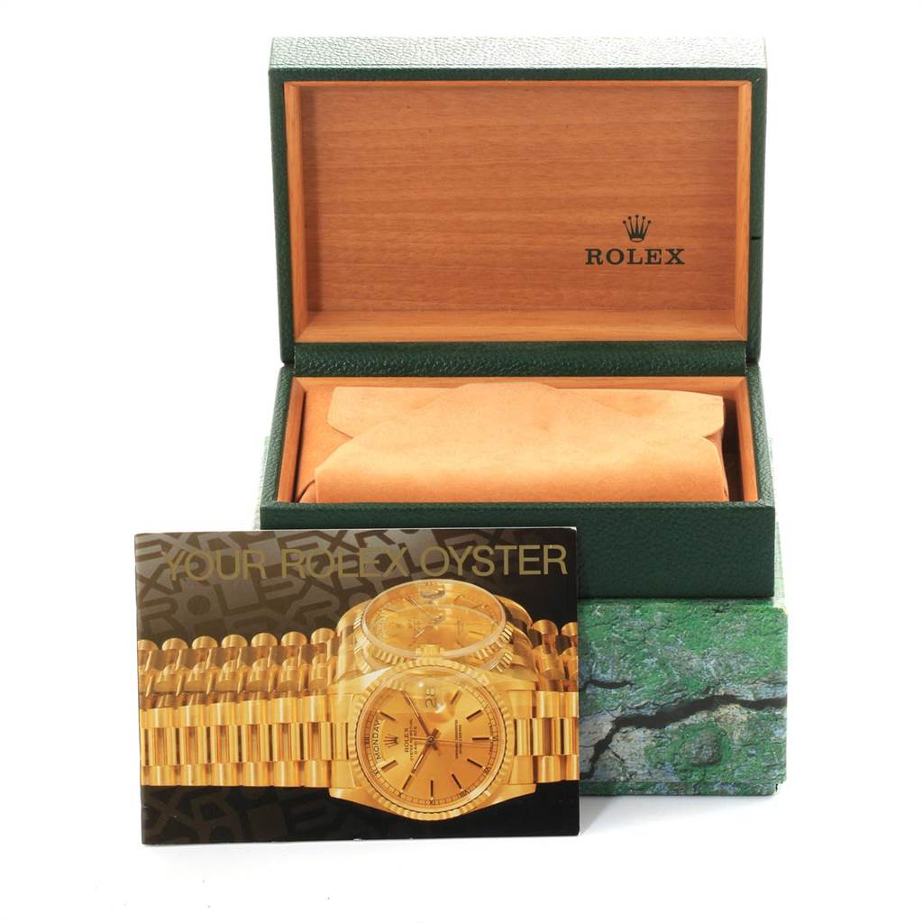 This image shows a Rolex President 68278 Women's Yellow Gold Blue Dial 68278 Women's Yellow Gold Blue Dial model watch in its open box with a brochure or card displaying the watch.
