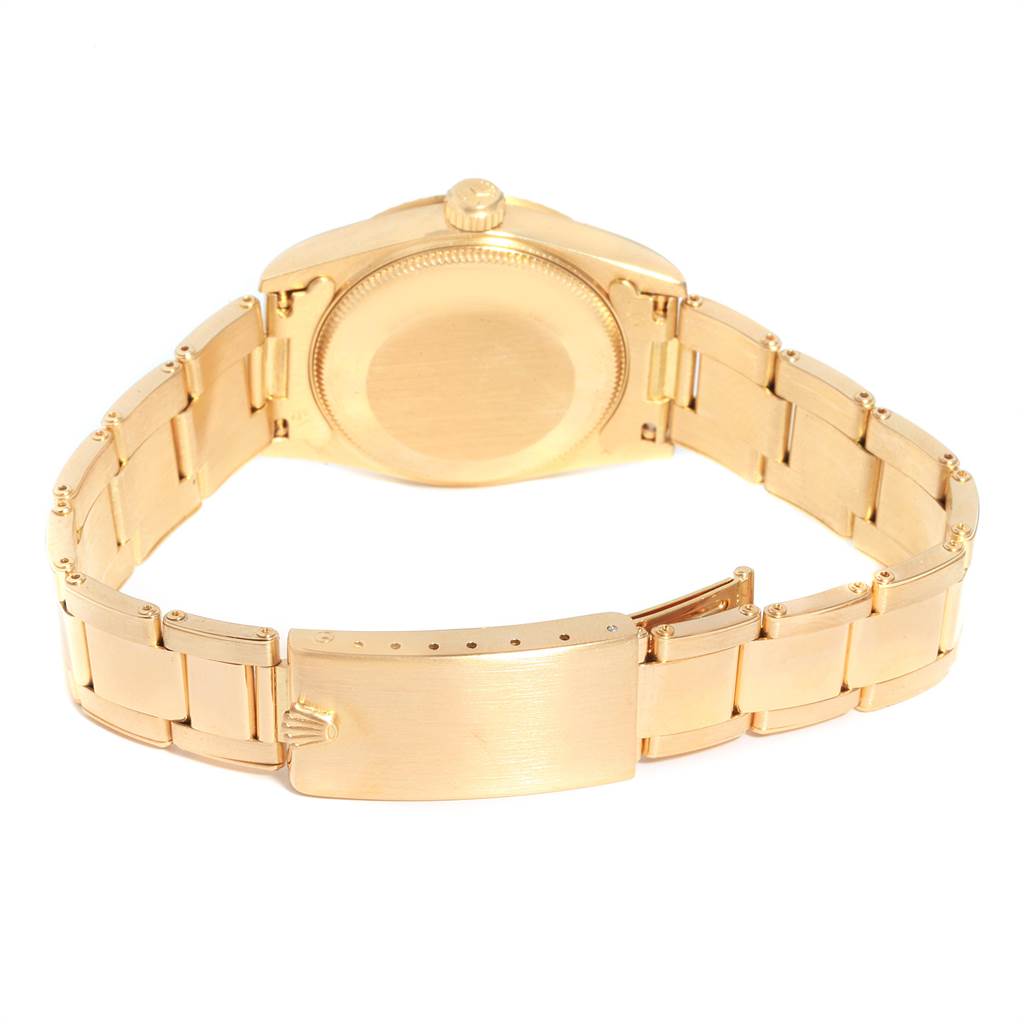 The image shows the reverse side of the Rolex President 68278 Women's Yellow Gold Blue Dial 68278 Women's Yellow Gold Blue Dial model watch, highlighting the case back and bracelet clasp.