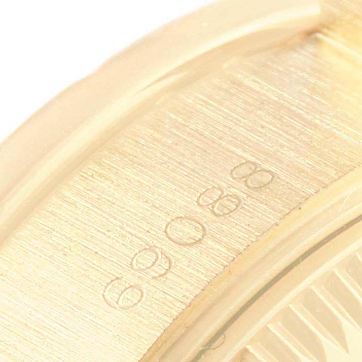 The image shows a close-up of the bezel or edge of the dial on a Rolex President 69088 Women
s Yellow Gold Champagne Dial 69088 Women
s Yellow Gold Champagne Dial model watch.