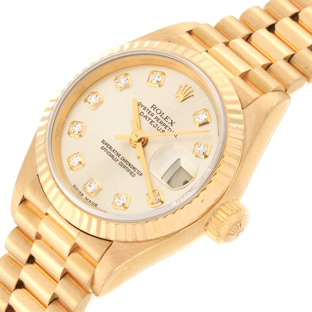This image shows a close-up of the Rolex President 69178 Women
s Yellow Gold Champagne Dial 69178 Women
s Yellow Gold Champagne Dial model watch, highlighting its face, crown, and bracelet from an angled perspective.