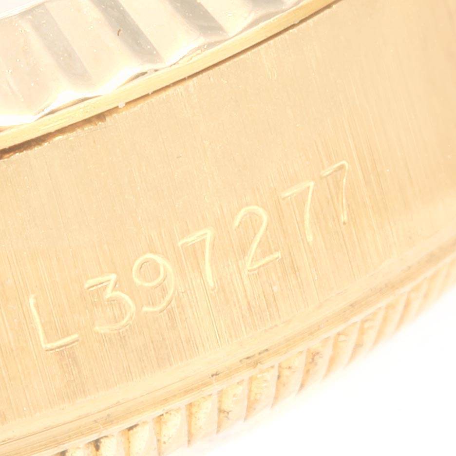 This close-up image shows the side view of the gold casing and serial number of a Rolex President 69178 Women
s Yellow Gold Champagne Dial 69178 Women
s Yellow Gold Champagne Dial model.