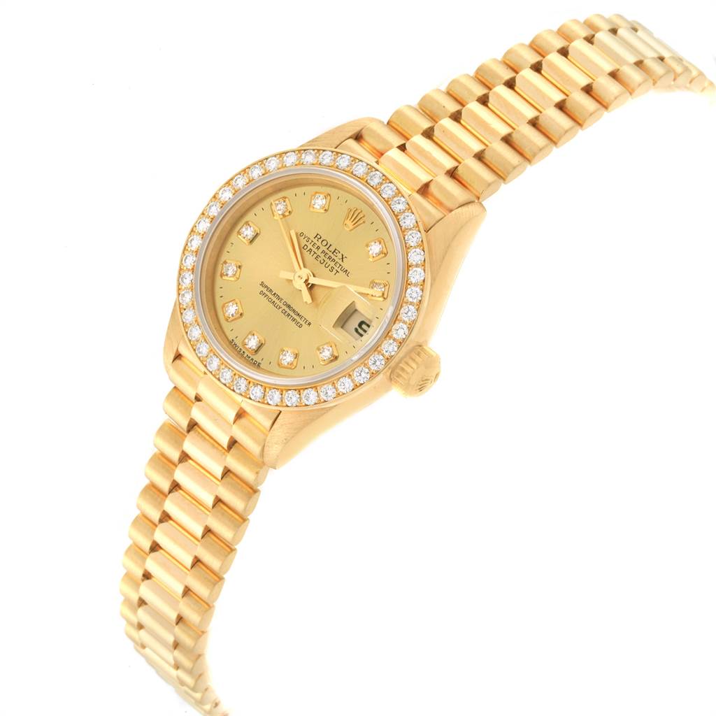 The image shows a Rolex President 69138 Women
s Yellow Gold Champagne Dial 69138 Women
s Yellow Gold Champagne Dial model watch at a slight angle, highlighting the face, bezel, and part of the band.
