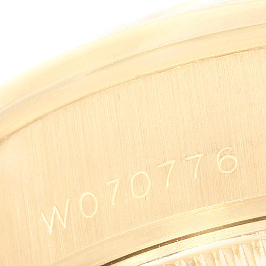 This close-up image shows the serial number engraving on the gold case back of a Rolex President 69138 Women
s Yellow Gold Champagne Dial 69138 Women
s Yellow Gold Champagne Dial model watch.