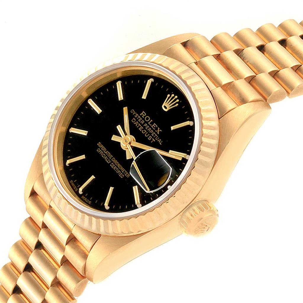This image shows an angled view of a Rolex President 69178 Women's Yellow Gold Black Dial 69178 Women's Yellow Gold Black Dial model, displaying the watch face, bezel, crown, and part of the bracelet.