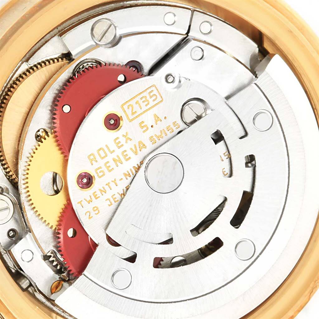 This is a close-up view of the internal mechanism of a Rolex President 69178 Women's Yellow Gold Black Dial 69178 Women's Yellow Gold Black Dial model watch, showing gears and components.