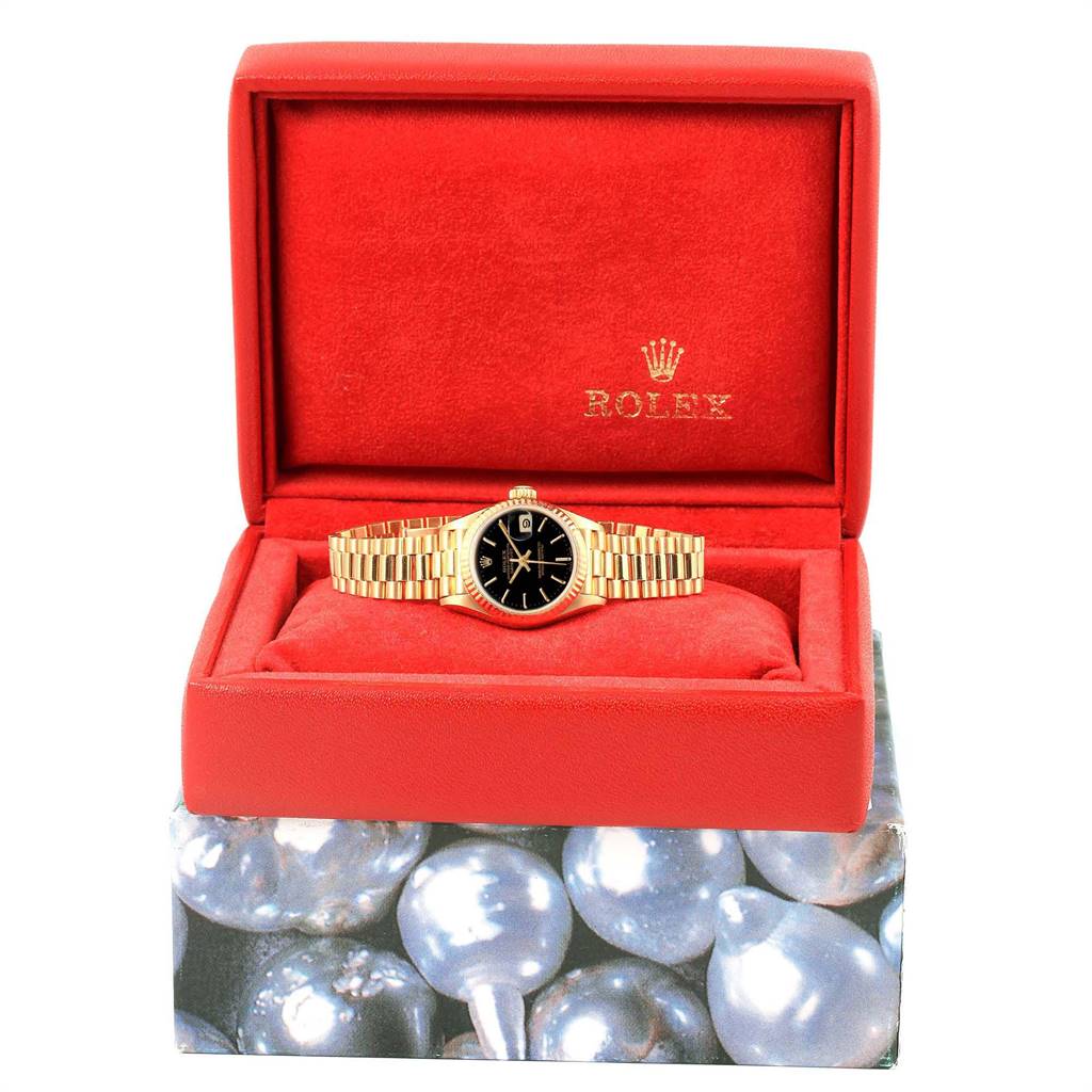The image shows a Rolex President 69178 Women's Yellow Gold Black Dial 69178 Women's Yellow Gold Black Dial model watch, displayed front-facing in a red Rolex box with a black dial and a gold bracelet.