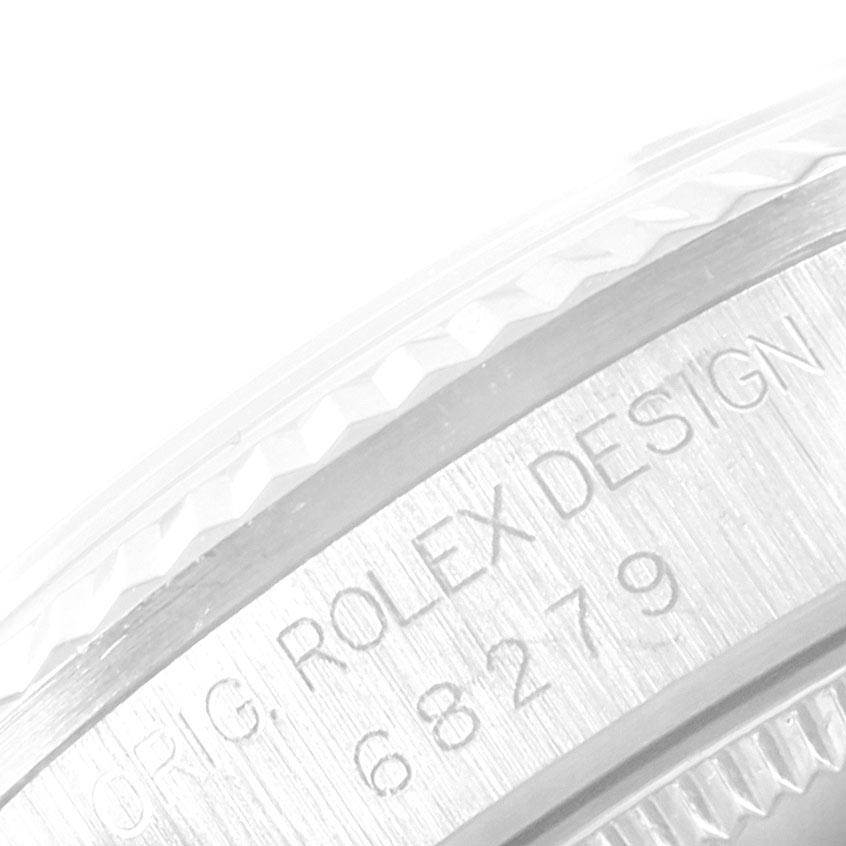 The image shows an extreme close-up of the engraved serial number on the case side of a Rolex President 68279 Women's White Gold Black Dial 68279 Women's White Gold Black Dial model watch.