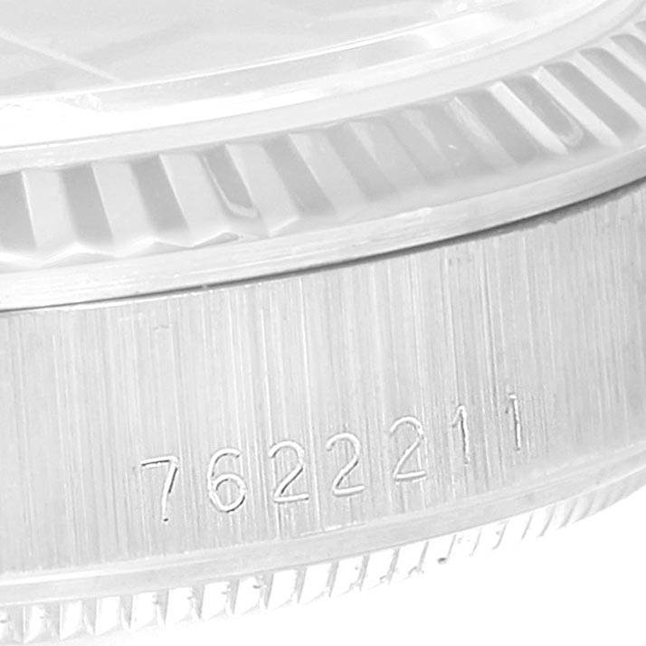 This image shows a close-up view of the side bezel and serial number of a Rolex President 68279 Women's White Gold Black Dial 68279 Women's White Gold Black Dial model watch.