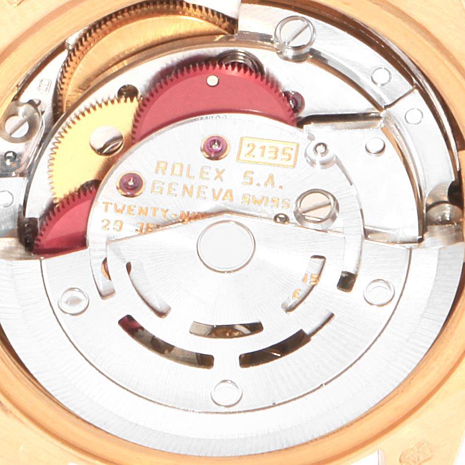 This image shows the movement mechanism of a Rolex President 69178 Women's Yellow Gold Black Dial 69178 Women's Yellow Gold Black Dial model watch, highlighting the intricate gears and components.