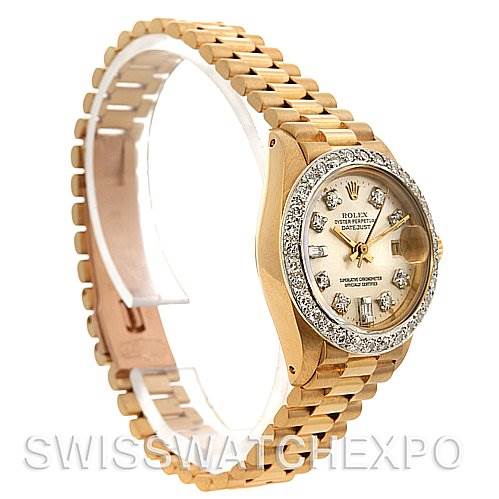 This image shows the Rolex President 6917 Women's Yellow Gold  6917 Women's Yellow Gold  model watch from a three-quarter angle, showcasing its diamond bezel, face, and bracelet.