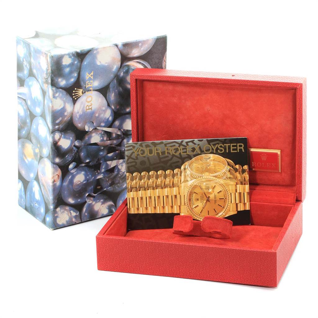 The image shows a Rolex President 69288 Women
s Yellow Gold Champagne Dial 69288 Women
s Yellow Gold Champagne Dial model watch packaging, including a red box and an informational booklet.