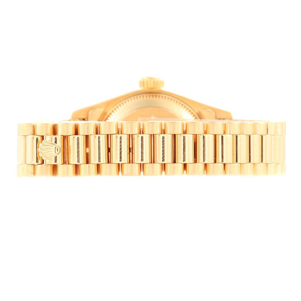 This image shows a close-up view of the bracelet and side of the case of a Rolex President 69178 Women
s Yellow Gold Champagne Dial 69178 Women
s Yellow Gold Champagne Dial model watch.