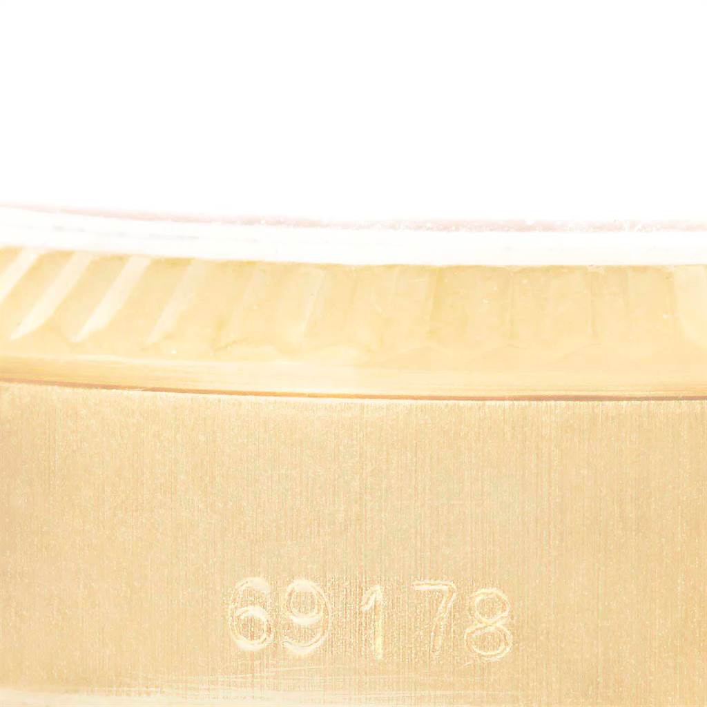 This close-up image shows the serial number "69178" engraved on the side of a Rolex President 69178 Women
s Yellow Gold Champagne Dial 69178 Women
s Yellow Gold Champagne Dial model watch case.