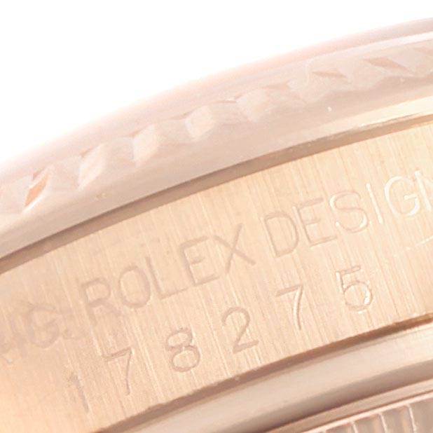 This is a close-up view of the Rolex President 178275 Women's Rose Gold Silver Dial 178275 Women's Rose Gold Silver Dial model showing its serial number engraved on the case.