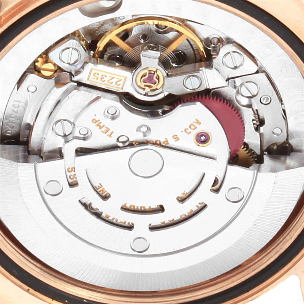 This close-up image shows the intricate inner mechanism of the Rolex President 178275 Women's Rose Gold Silver Dial 178275 Women's Rose Gold Silver Dial watch model.