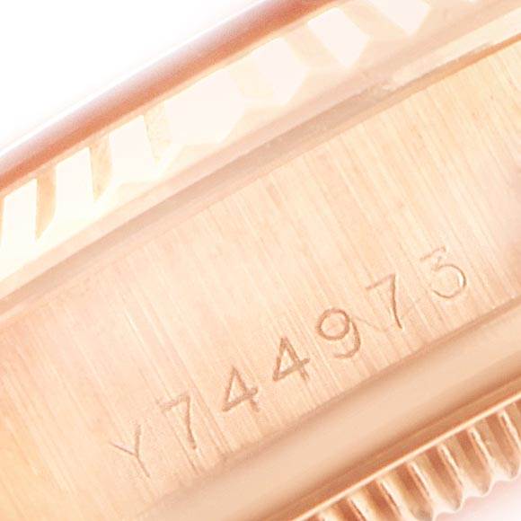 This image shows a close-up of the serial number engraving on the side of the case of a Rolex President 178275 Women's Rose Gold Silver Dial 178275 Women's Rose Gold Silver Dial watch.