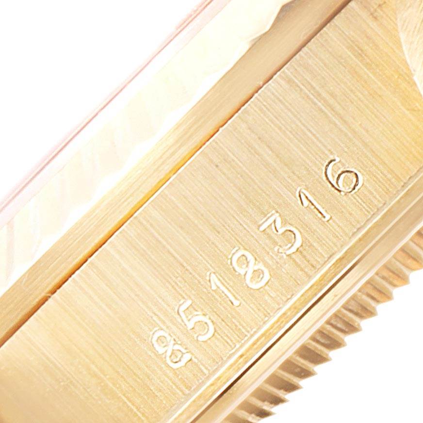 This close-up image shows the serial number and fluted bezel of the Rolex President 68278 Women's Yellow Gold Silver Dial 68278 Women's Yellow Gold Silver Dial model watch.