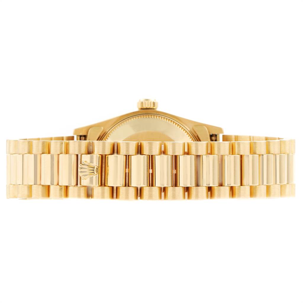 The image shows the back view of a Rolex President 68278 Women's Yellow Gold Silver Dial 68278 Women's Yellow Gold Silver Dial model watch, prominently displaying its gold bracelet and clasp.