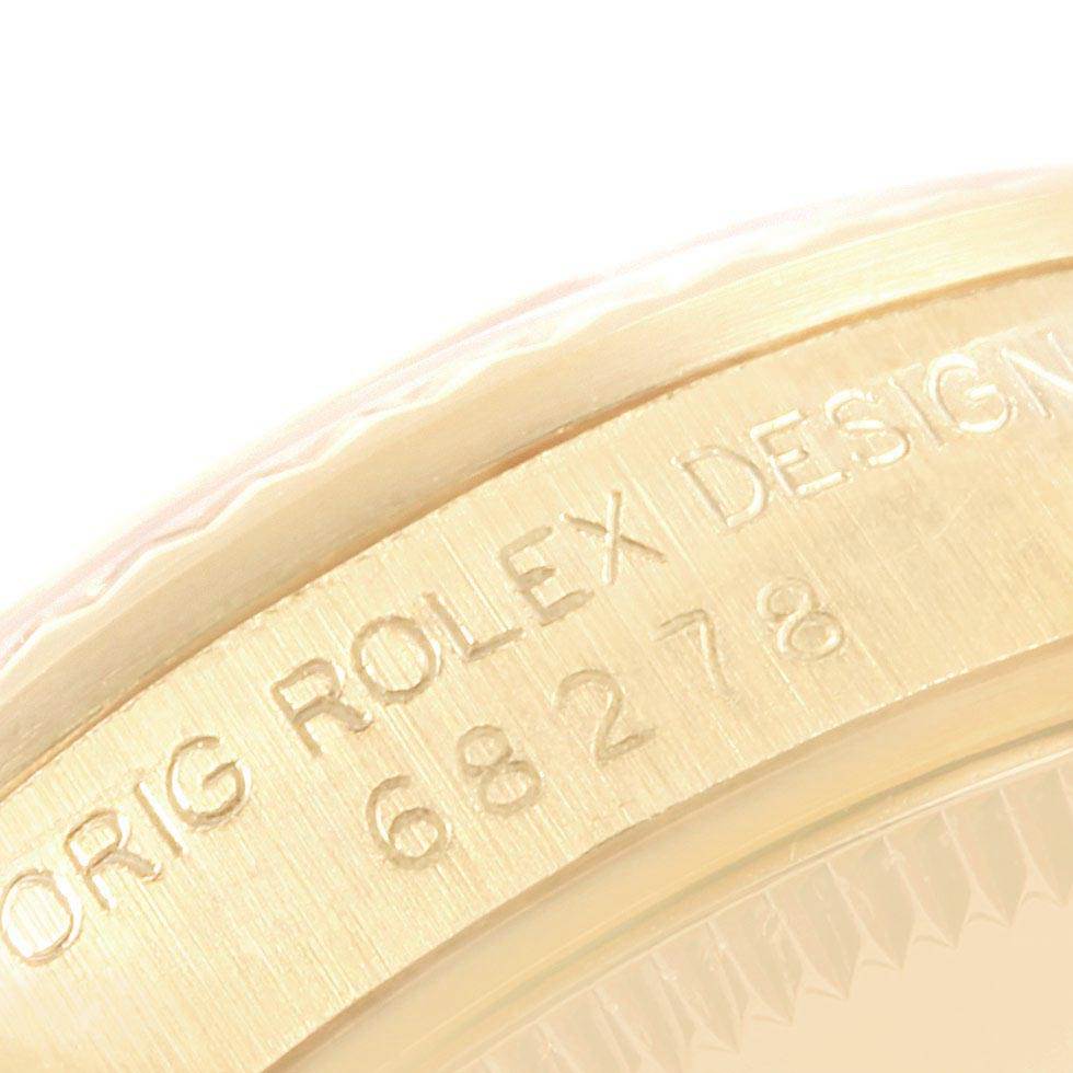 The image shows a close-up of the side engraving on a Rolex President 68278 Women's Yellow Gold Silver Dial 68278 Women's Yellow Gold Silver Dial model watch, featuring the design number.